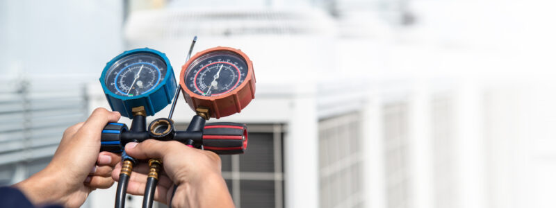 Technician is checking air conditioner ,measuring equipment for filling air conditioners . Technician is checking air conditioner ,measuring equipment for filling air conditioners , service and maintenance air conditioner .