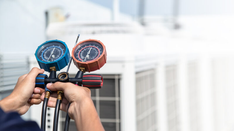 Technician is checking air conditioner ,measuring equipment for filling air conditioners . Technician is checking air conditioner ,measuring equipment for filling air conditioners , service and maintenance air conditioner .