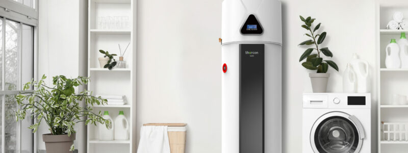 Boiler thermodynamique thercon - installation par KeepCool Hainaut Modern washing machine with basket and shelving units near white wall. Interior of home laundry room